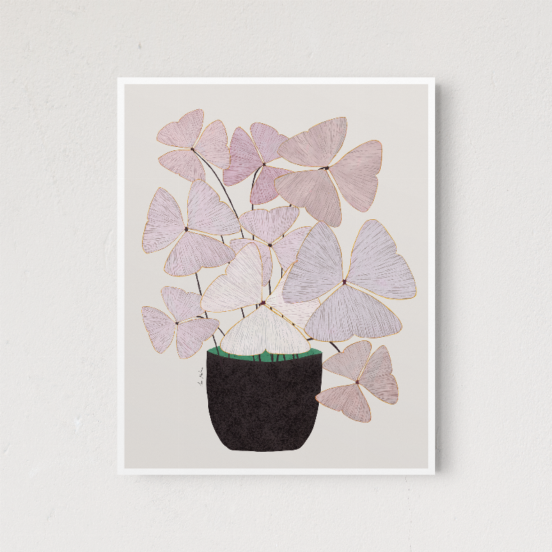 Framed floral wall art with pastel pink blossoms and lavender flowers in a dark pot