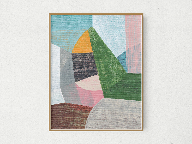 Framed abstract print with geometric shapes in blue, green, pink, and gray, wood frame