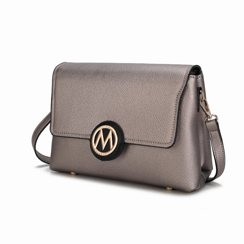 Gray crossbody bag with flap closure, circular logo medallion, and adjustable strap