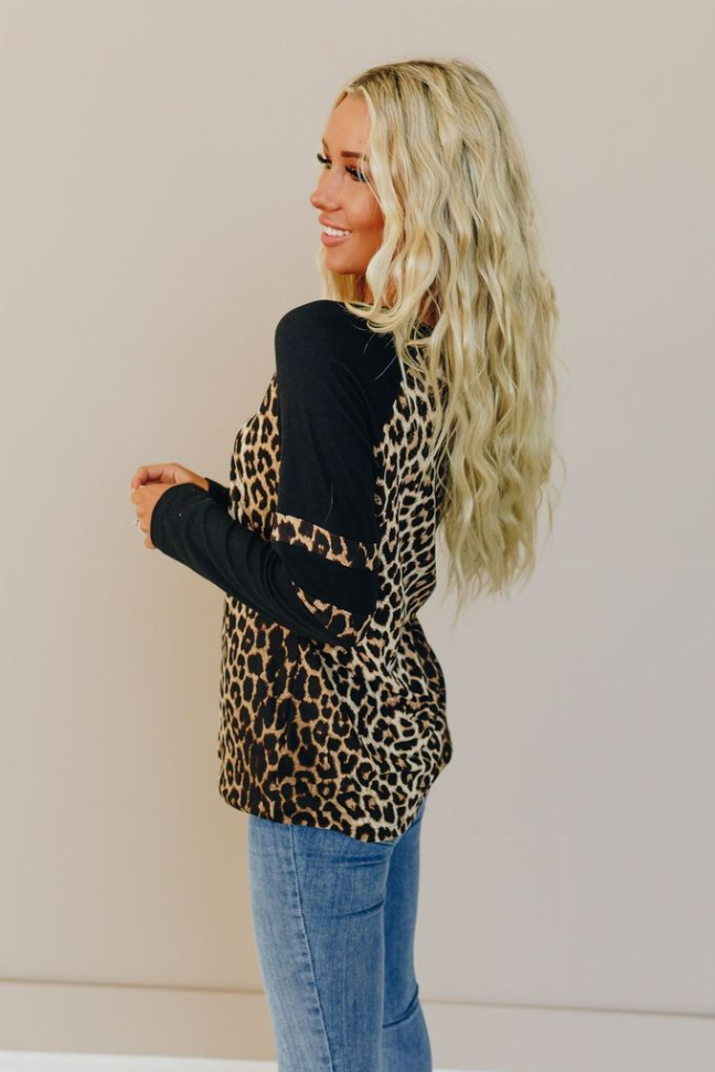 Side view leopard-print varsity tee with black sleeves and sleeve stripe detail
