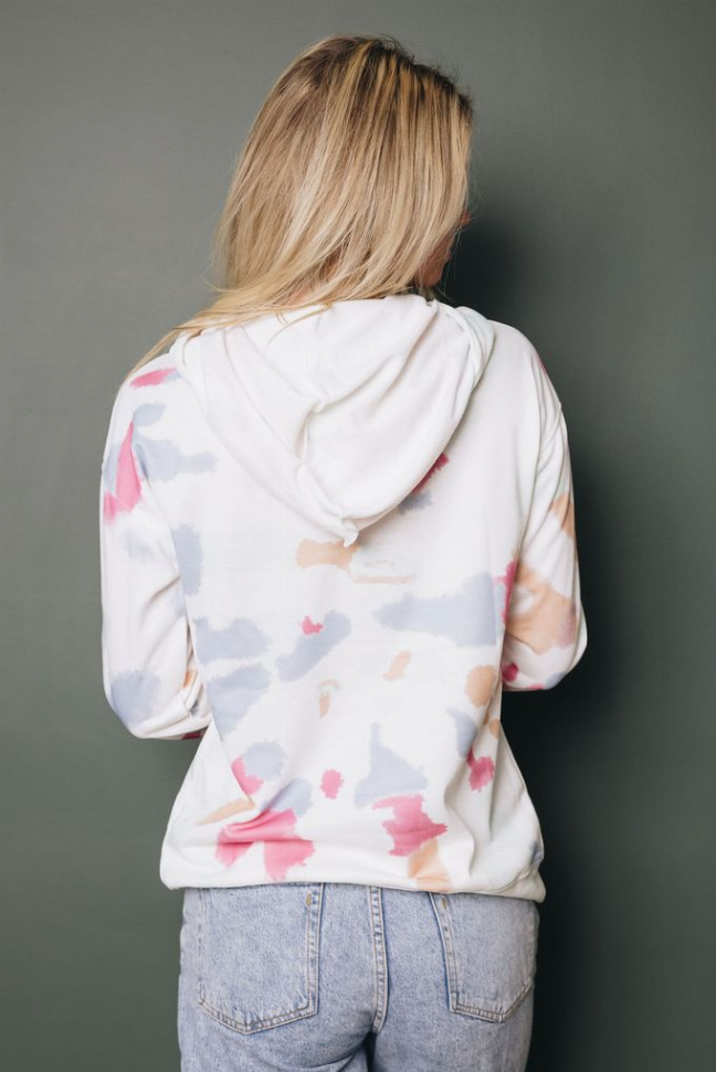 White tie-dye hoodie with pink/peach splatter, hood and pouch pocket, back view