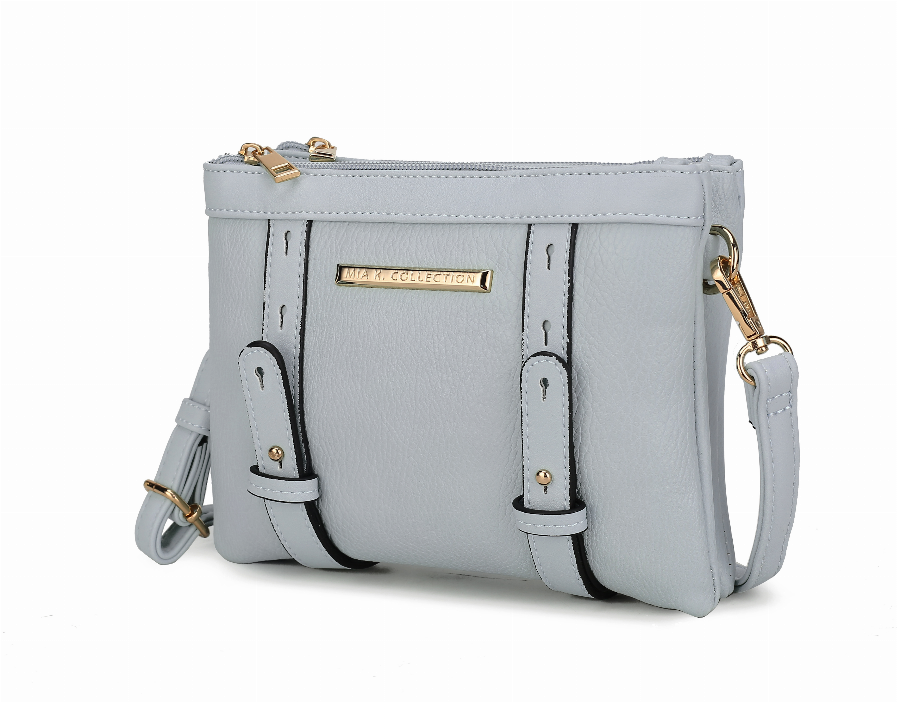 Light blue crossbody bag with top zipper, front pockets, and gold-tone hardware