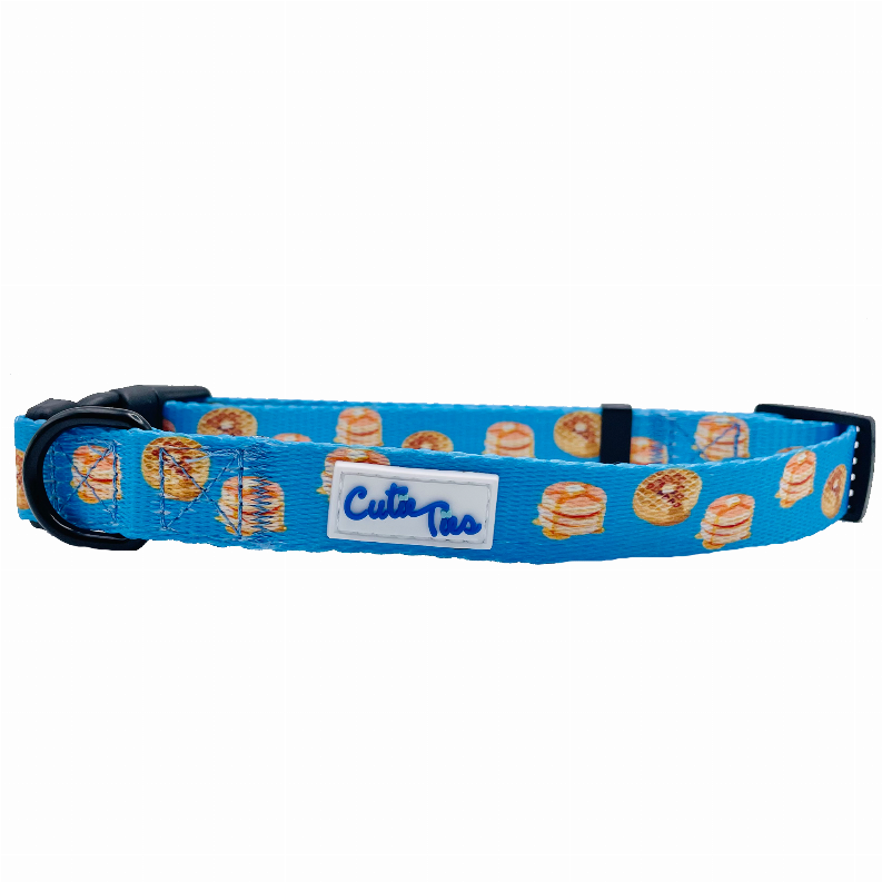 Blue hamburger-print dog collar with black buckle and Cutie Ties branded patch
