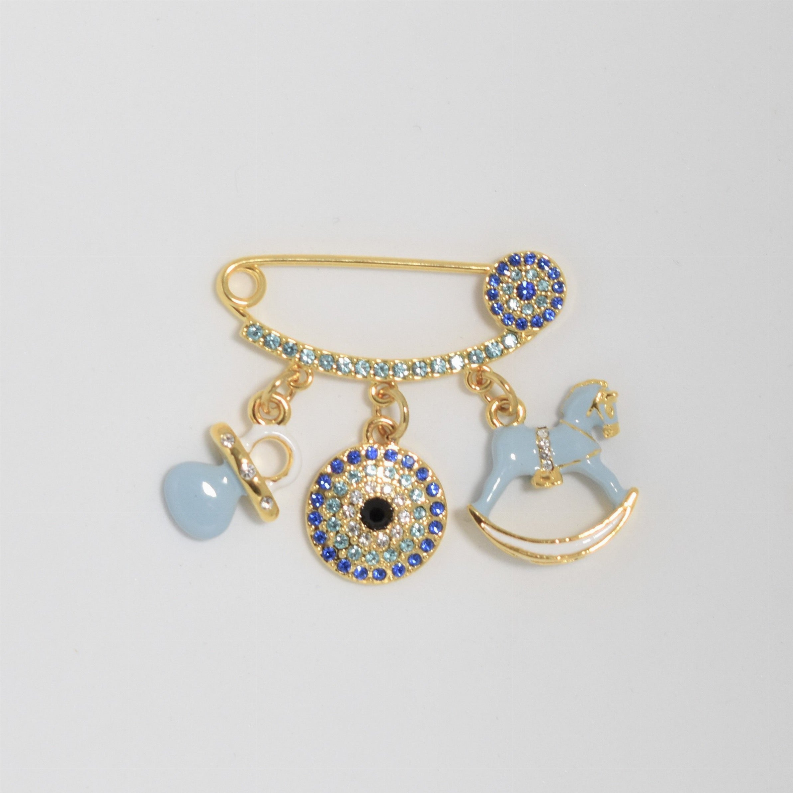 Gold-tone baby pin with blue enamel heart, evil-eye disc, and carousel rocking horse charm