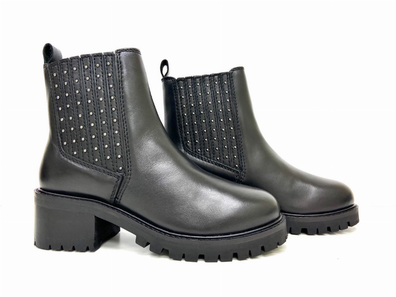 Black platform Chelsea boots with studded elastic panels and thick rugged sole