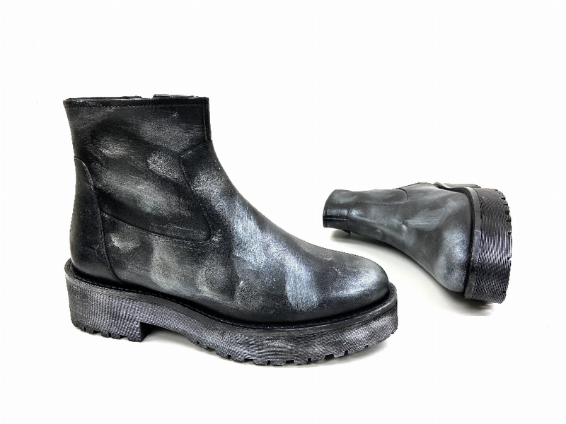 Black ankle bootie angled view, side zipper and chunky platform lug sole