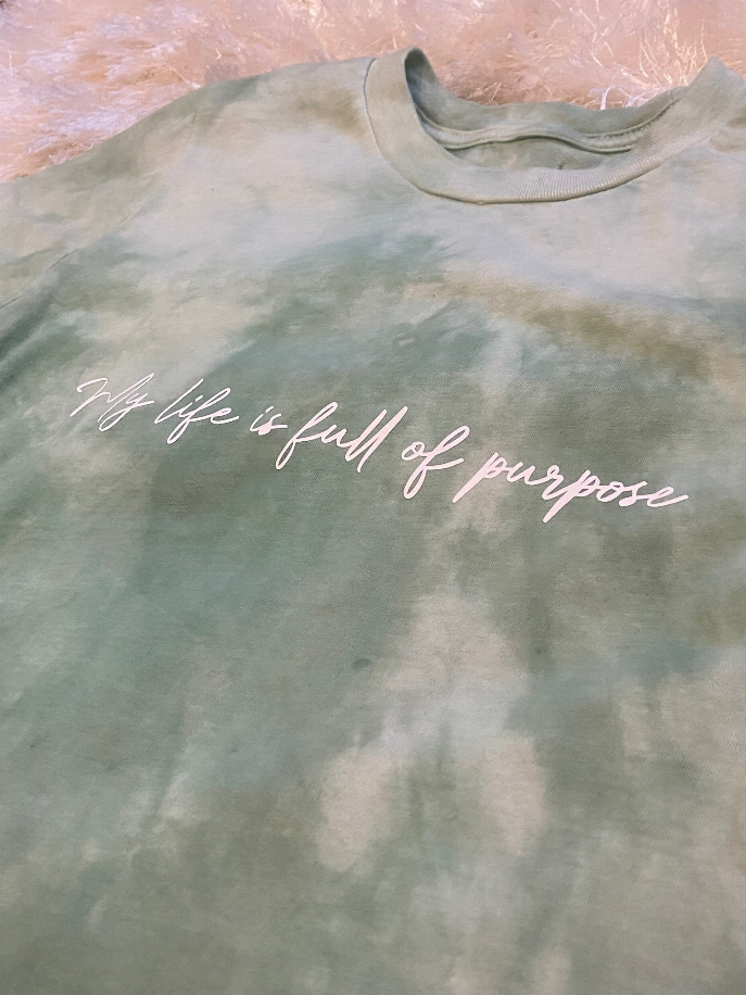 Sage tie-dye T-shirt with white cursive "my life is full of purpose"