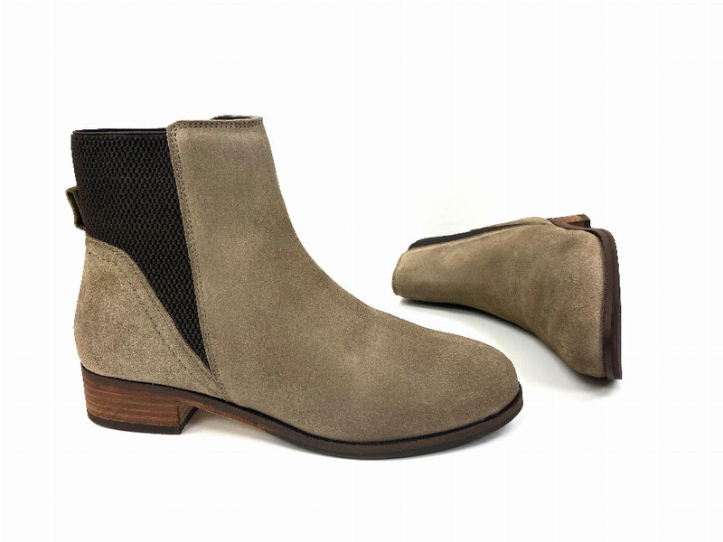 Pair of tan suede Chelsea booties with black elastic sides and stacked block heels