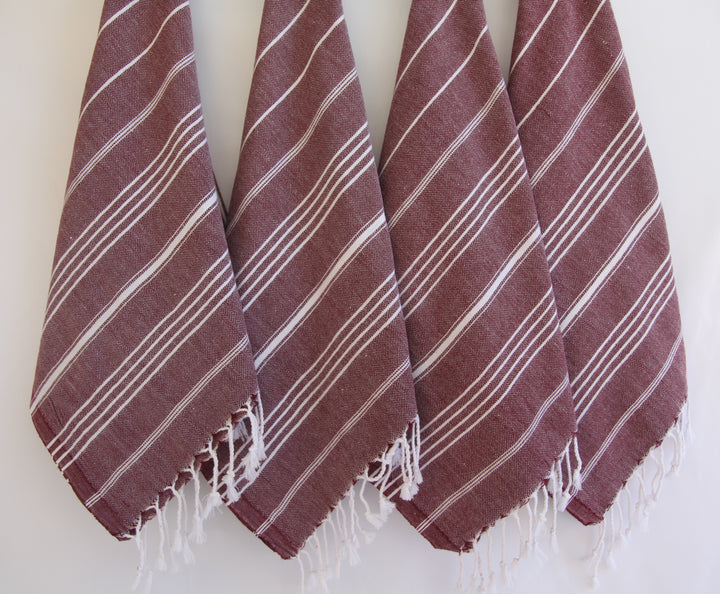 Hand towel set, maroon with diagonal white stripe pattern and tassel fringe ends.