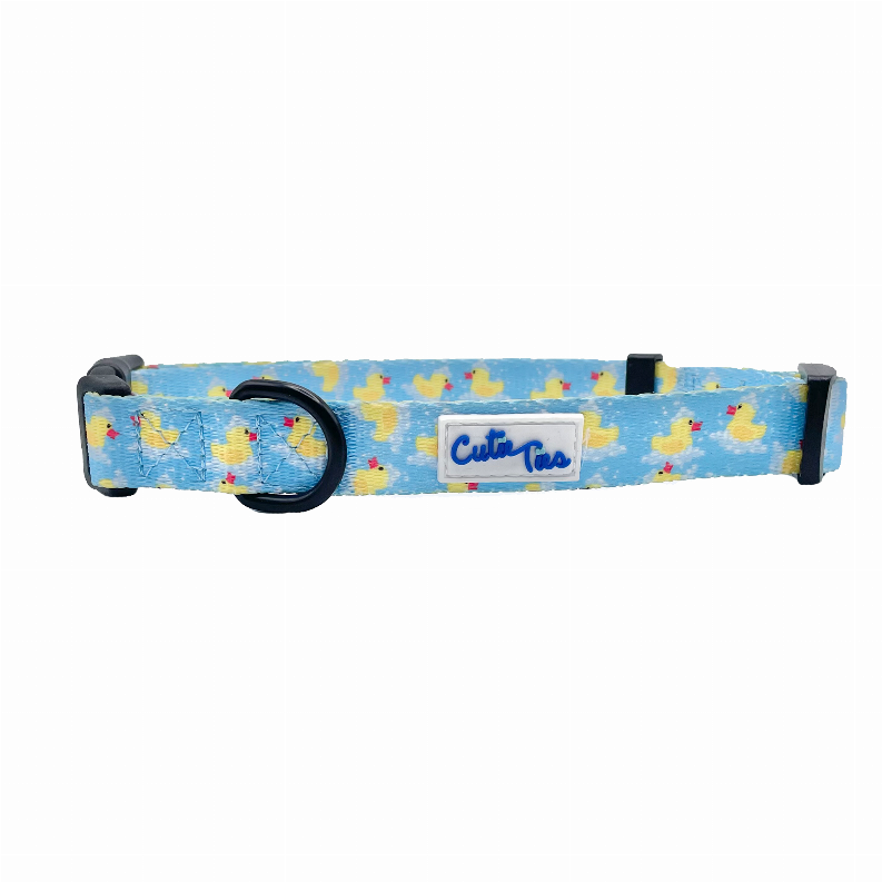 Blue duck print dog collar with black hardware and logo label on strap