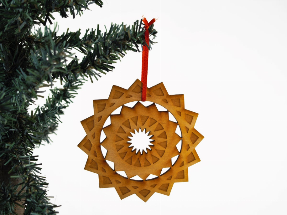 Wood quilted star tree ornament with red hanging loop and carved center medallion