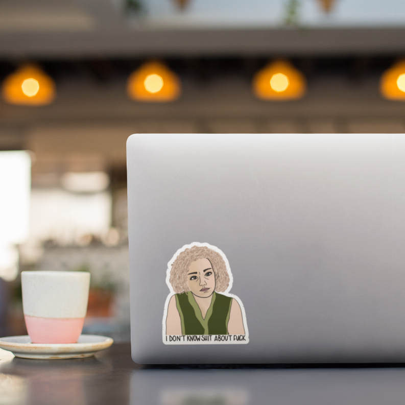 Sticker portrait of curly-haired woman with green vest and quote on laptop