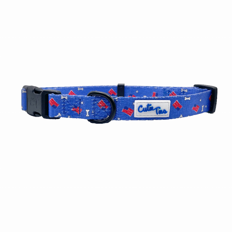 Blue dog collar with patriotic pattern and logo patch, black buckle and D-ring