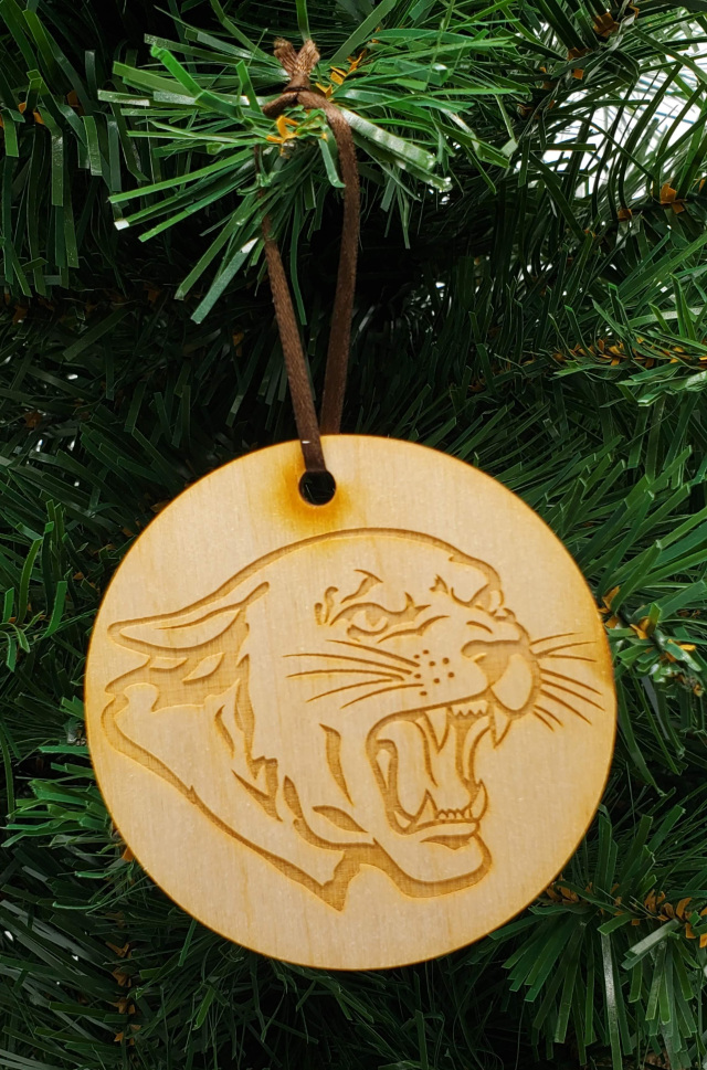 Round unfinished wooden tree ornament with carved cougar head design and loop for hanging