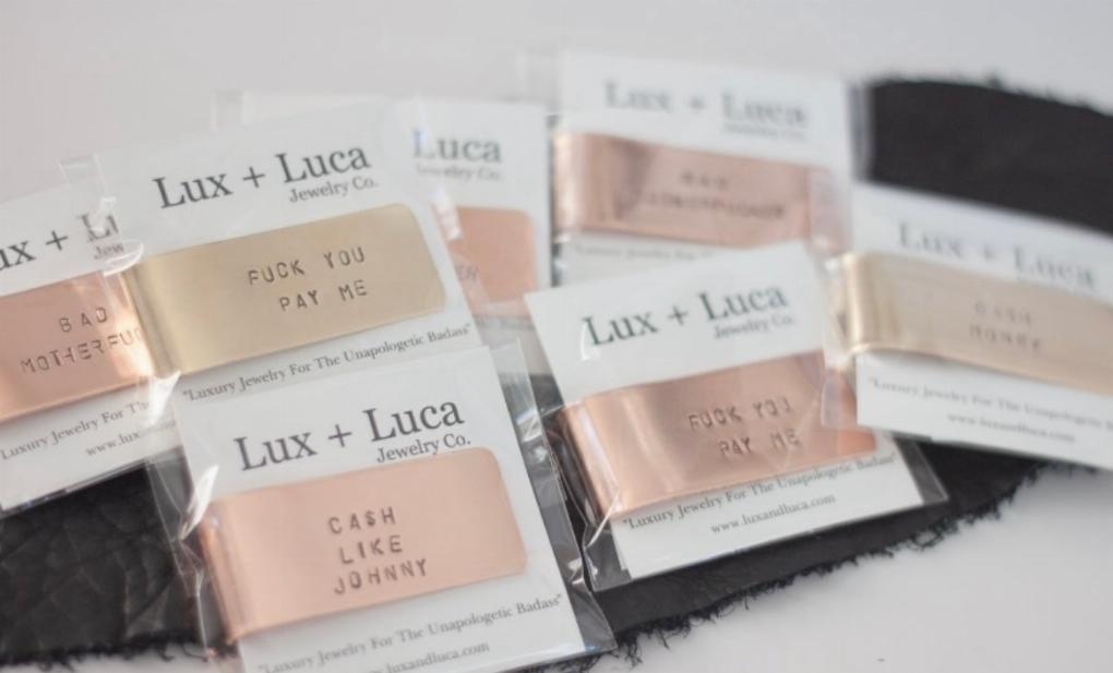 Lux + Luca money clip retail packages with Copper designs visible