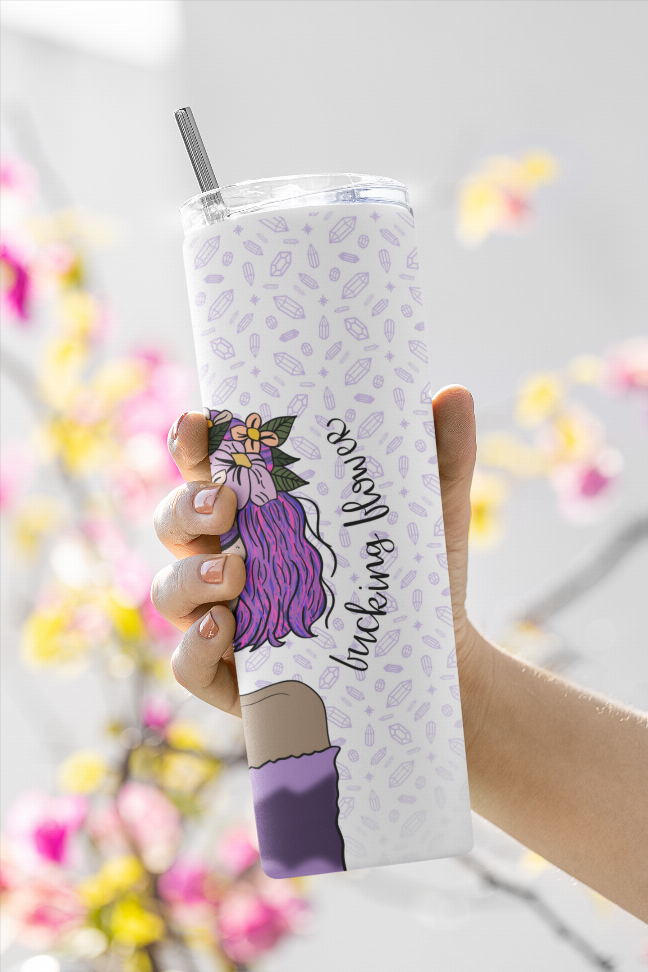White tumbler with purple flower girl and bow, clear straw, held in hand