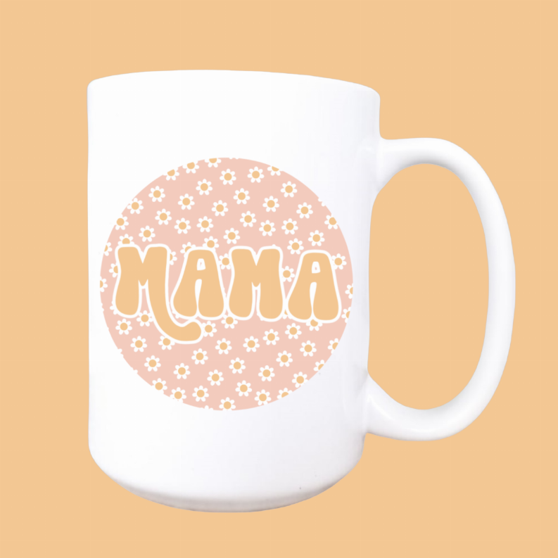 White ceramic coffee mug front print: pink floral circle with 'MAMA' letters, right handle