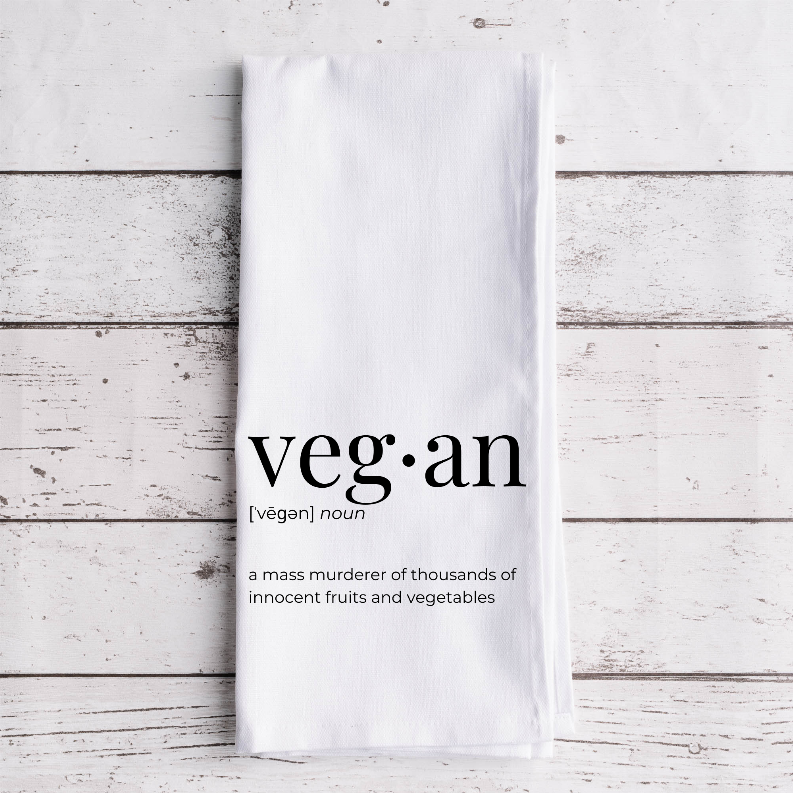 White tea towel with 'veg·an' wordmark and quote about fruits and vegetables