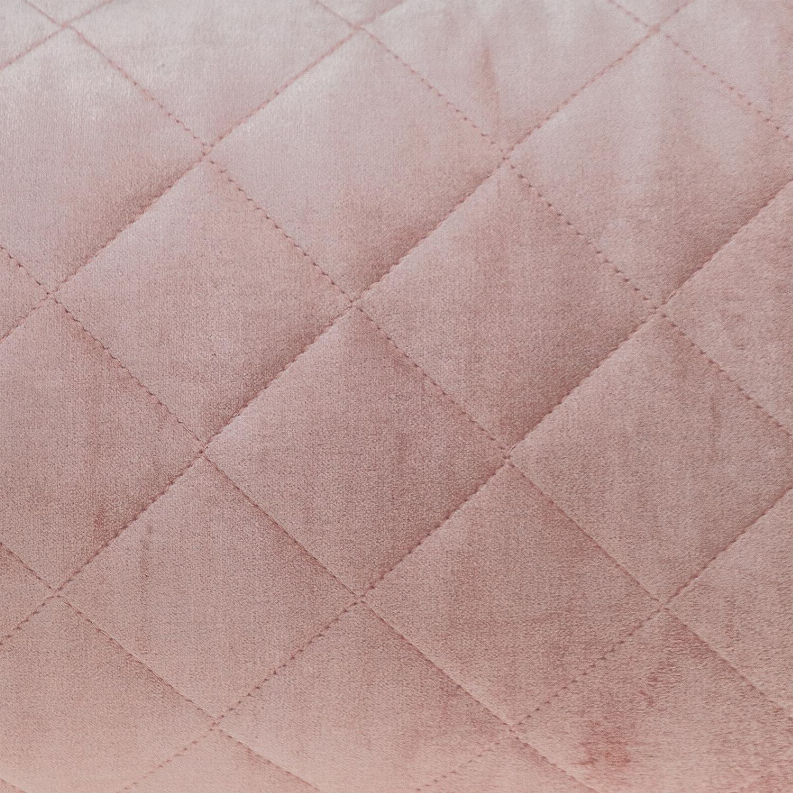 Pink quilted pillow with diamond stitching texture close-up