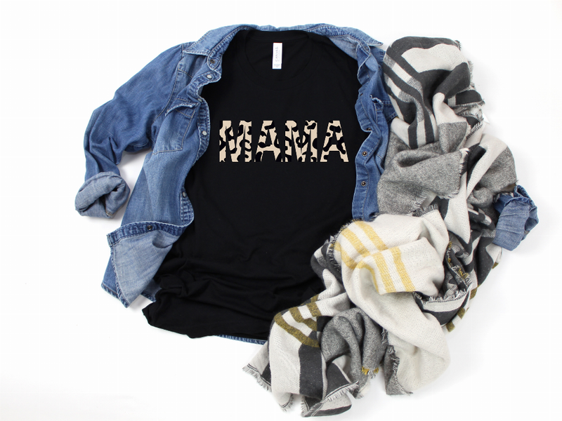 Black graphic T-shirt with animal-style print, with open denim jacket and striped scarf