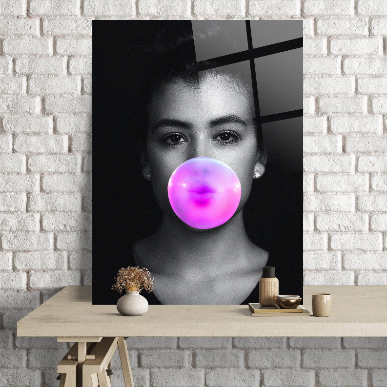 Rectangular wall art portrait of a woman with a pink gummy-glass bubble on black
