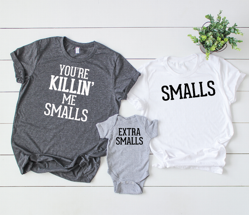Graphic T-shirts with gray onesie: 'EXTRA SMALLS' (onesie) and 'SMALLS' (white)