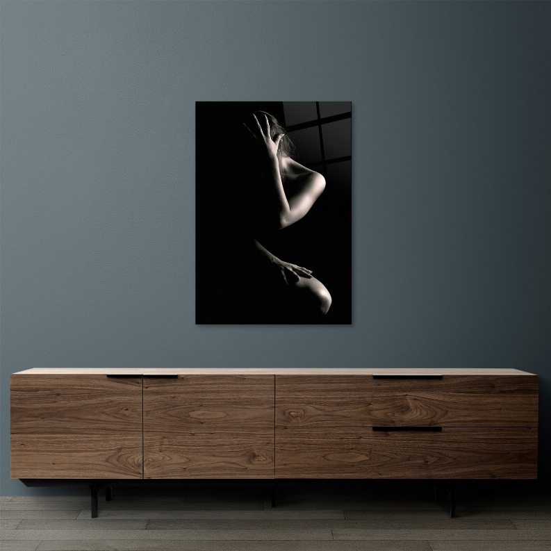 Glass wall art panel with stylized nude silhouette, black square design