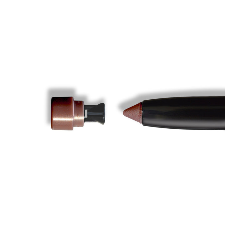 Side view of eye shadow crayon with copper-toned tip on black body