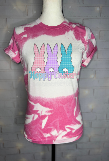 Pink and white bleached Easter graphic T-shirt with bunny icons and Hoppy Easter text