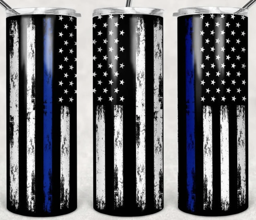 Stainless steel tumbler with American flag stars and vertical stripes in black, blue, white.