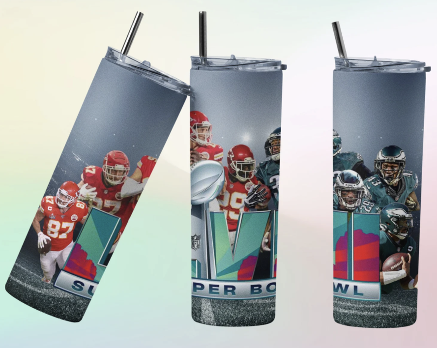 Blue stainless steel tumbler with football player graphic, clear lid and two drinking straws