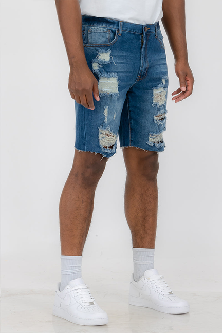 Blue washed distressed denim shorts with ripped front and frayed hem