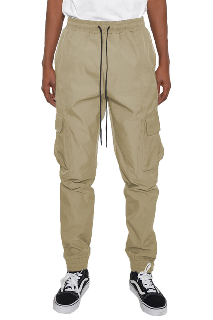 Beige iridescent cargo jogger pants with elastic waistband, drawstring, and side pockets