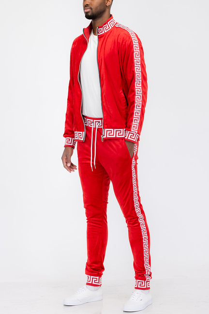 Red velour track set with white Greek key trim, zip jacket and jogger pants