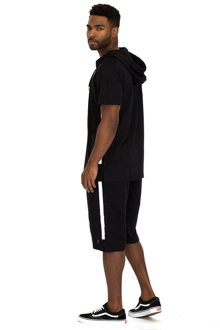 Black athletic short set, side view: hooded top with zipper and matching shorts with white stripe