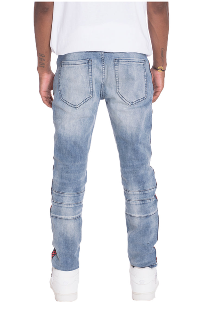 Light blue denim jeans with stitched back pockets and knee seams