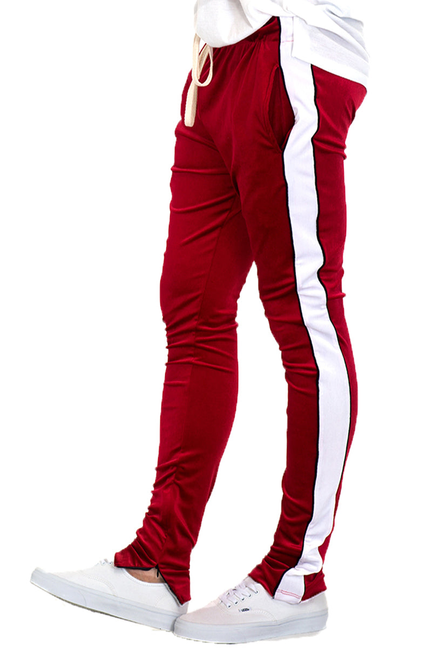 Men's red velour track pants with white side piping and elastic cuffs