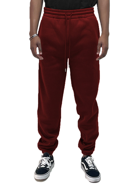 Burgundy fleece sweat pants with elastic waistband and drawstring, tapered legs