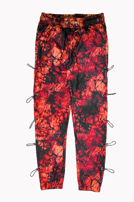 Red and black graphic joggers with elastic waist, side toggle cords, and adjustable cuffs.