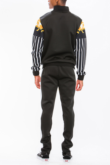 Printed track set: black track jacket back with orange-gold scroll print and striped sleeves