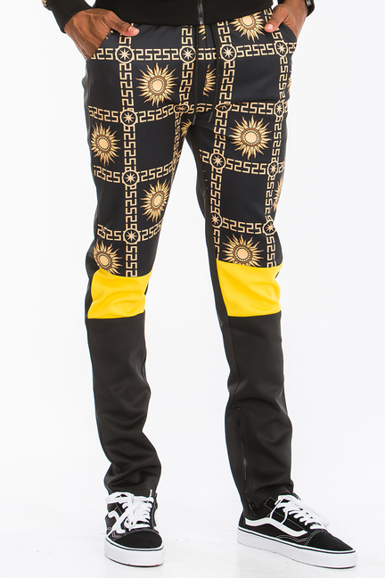 Men's black track pants with gold geometric print, yellow pocket panels, straight legs