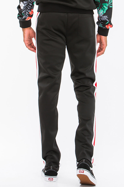 Men's track pants, black with red/white side stripe detail at outer seams