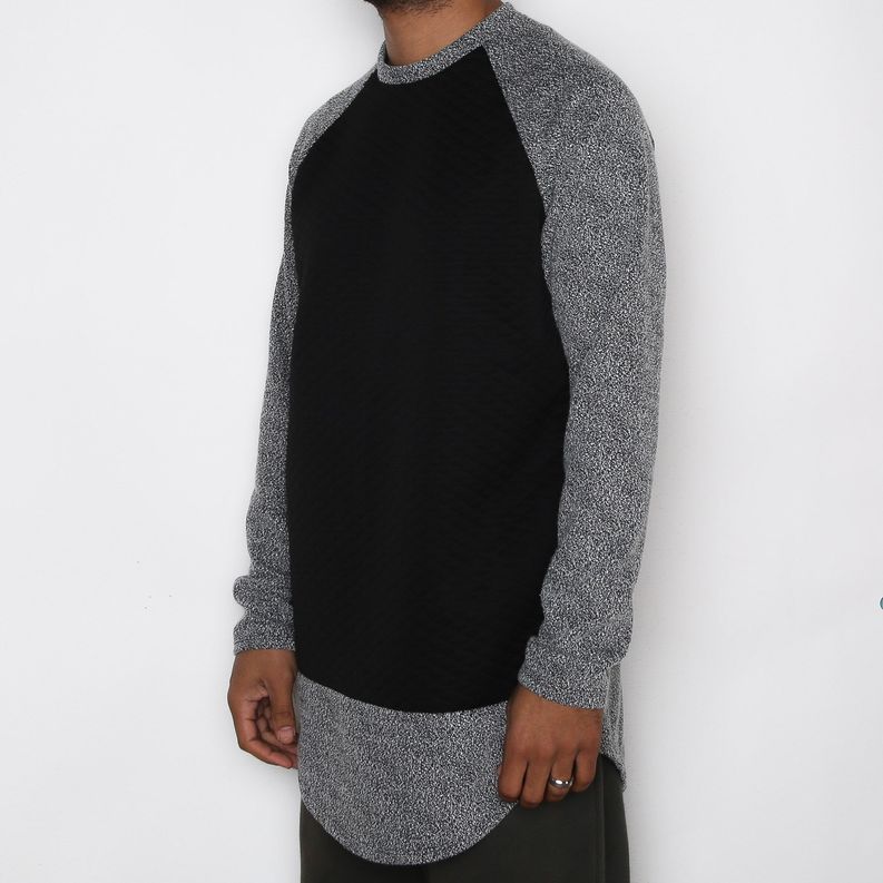 Raglan baseball tee with black front, heather gray sleeves and scalloped hem