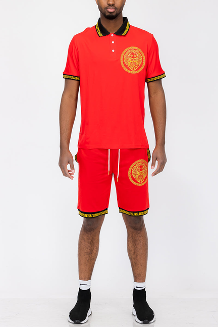 Red polo shirt and matching shorts set with lion-head crest and yellow trim