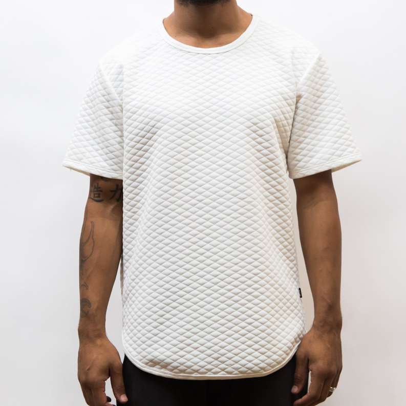 White quilted scallop tee, front view with crew neck and curved hem