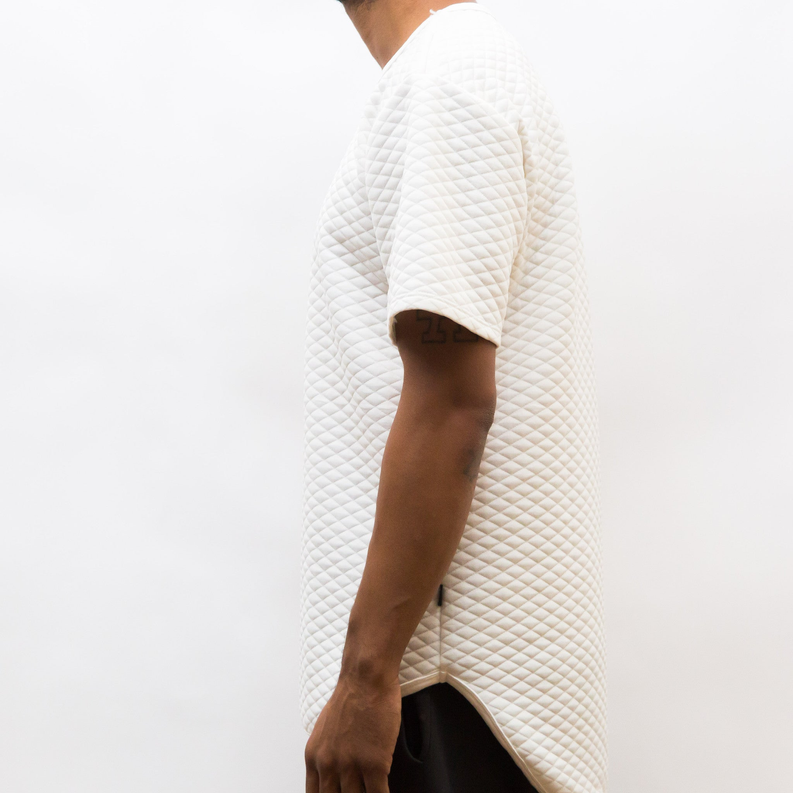 White quilted scallop tee, side view on model