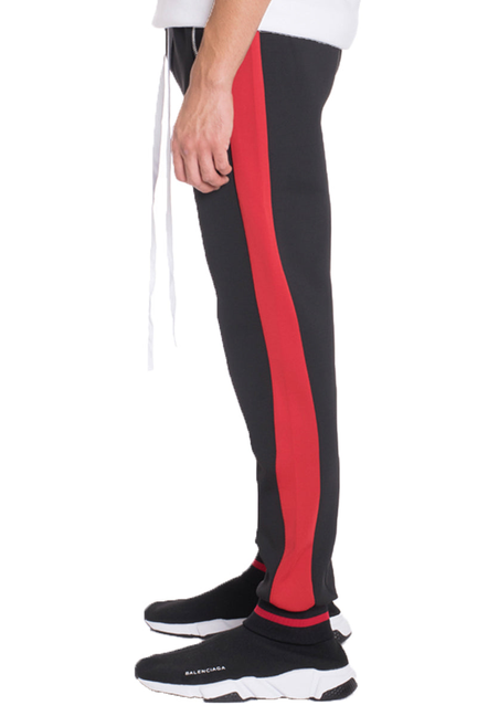 Heavy weight jogger pants with red side stripe, tapered black legs, elastic cuffs