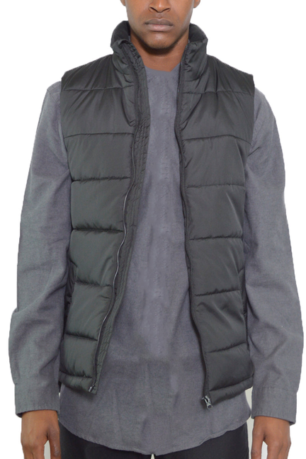 Padded sleeveless vest with stand collar, dark front zipper, quilted panels