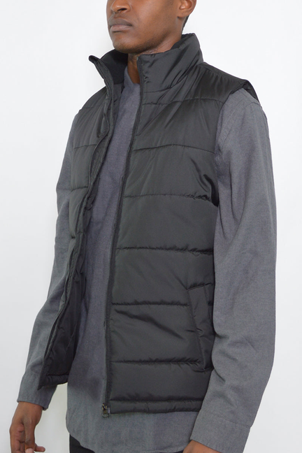 Sleeveless quilted padded vest with high collar and front zipper, dark
