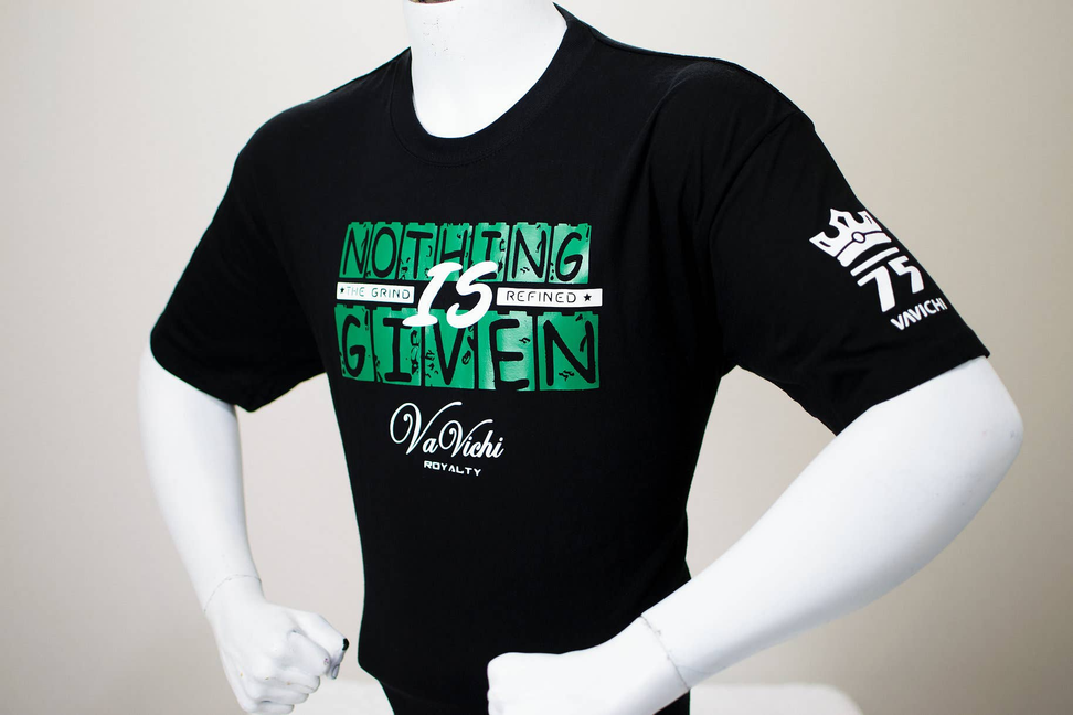 Black short-sleeve tee with green 'NOTHING IS GIVEN' front graphic and right-sleeve 777 print